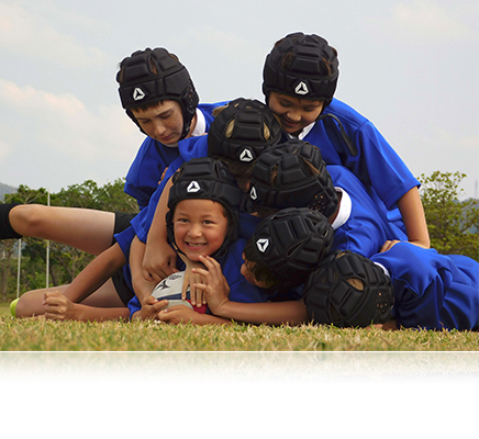 COOLPIX B500 photo of 7 boys playing rugby piled on the ball
