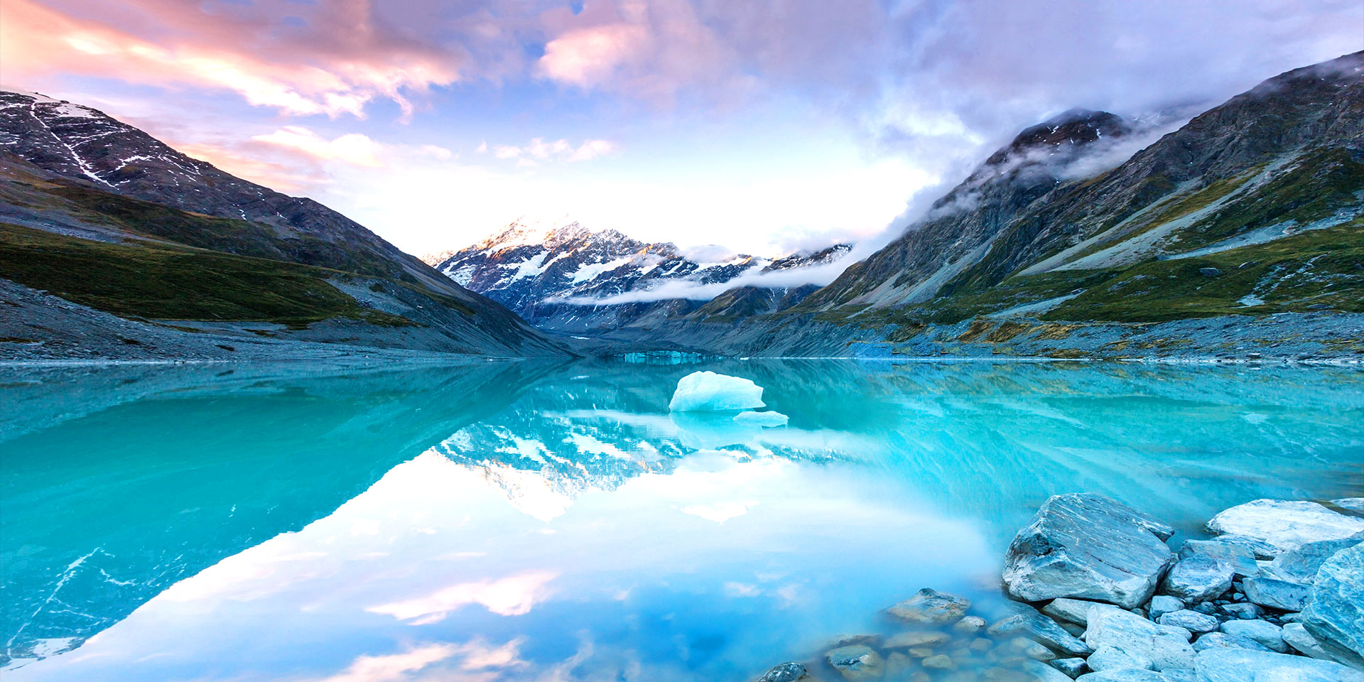 Galaxy A80’s New Infinity Display shows a vivid cinematic view of icy mountains and sea in landscape mode. Photo continues on-screen.