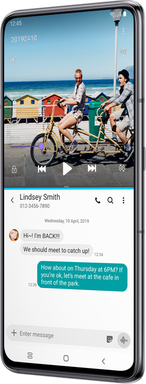 Galaxy A80 with a video playing at the top and Message App open at the bottom to show ways to multitask.